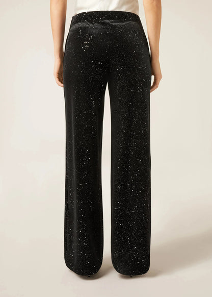 Pantalon noir à jambe droite avec motif moucheté sur toute la surface